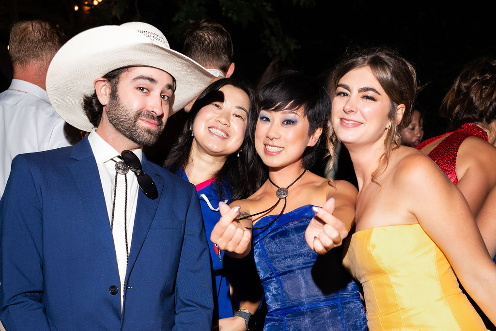 Friends dance on the dance floor during a wedding reception