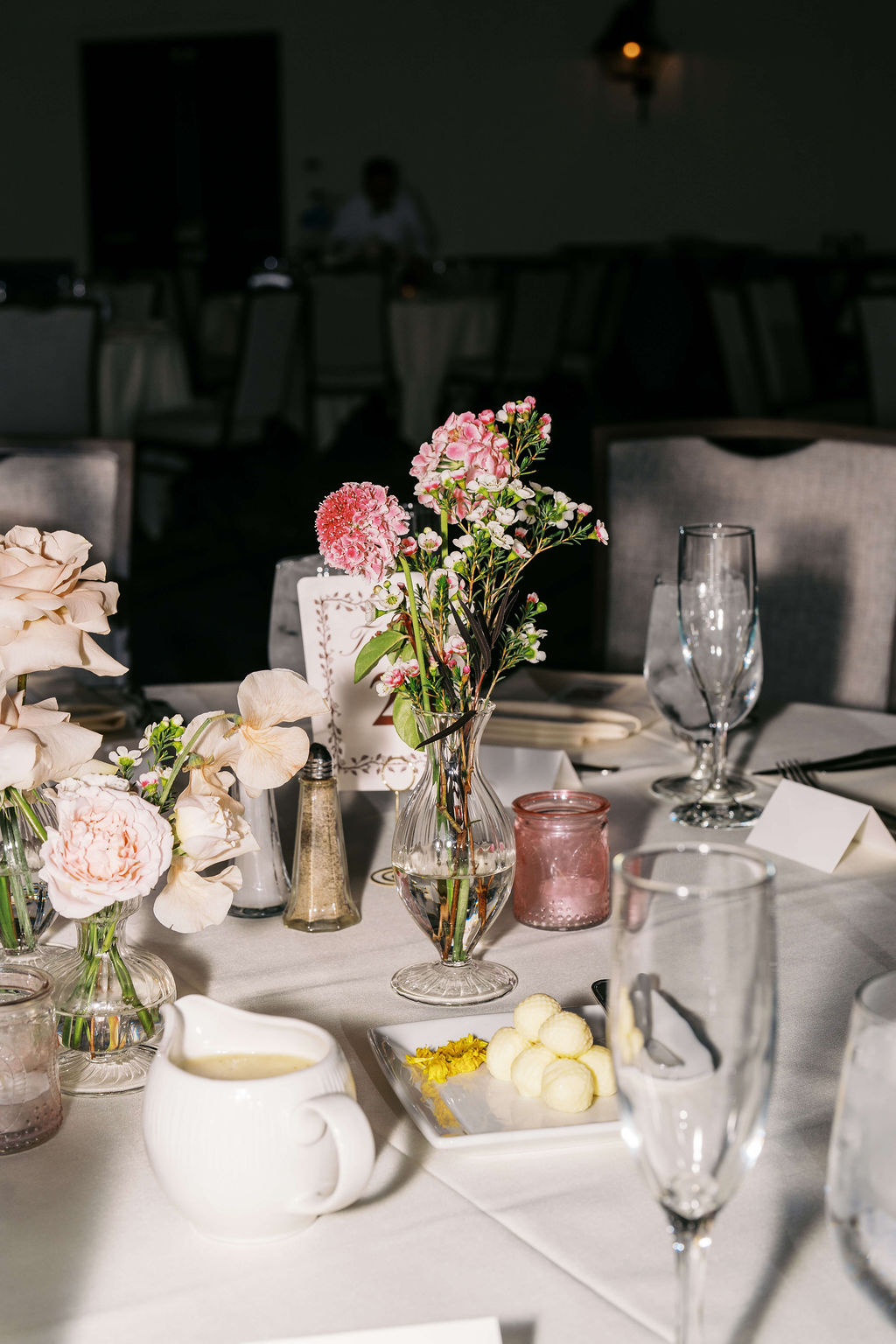 Details of a wedding reception table with pink carnations