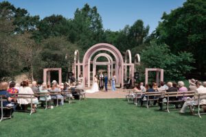 Wedding ceremony under the Lilac Arches in the Finger Lakes Region